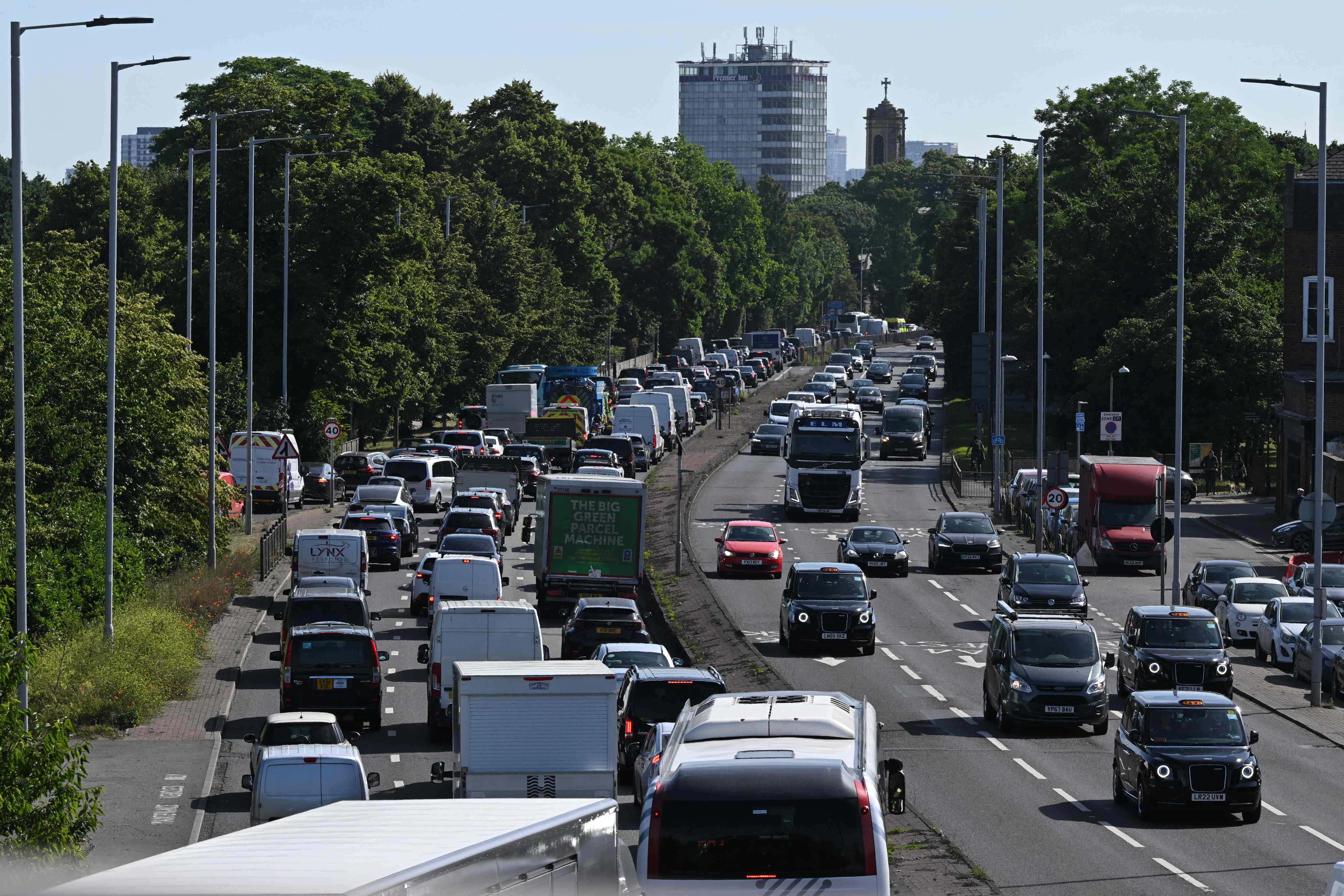 Commuters head onto the roads in Hammersmith as trains are cancelled across the country