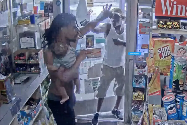 <p>A Detroit father is seen fighting off a gas station gunman while he held his baby with one arm on Father’s Day</p>