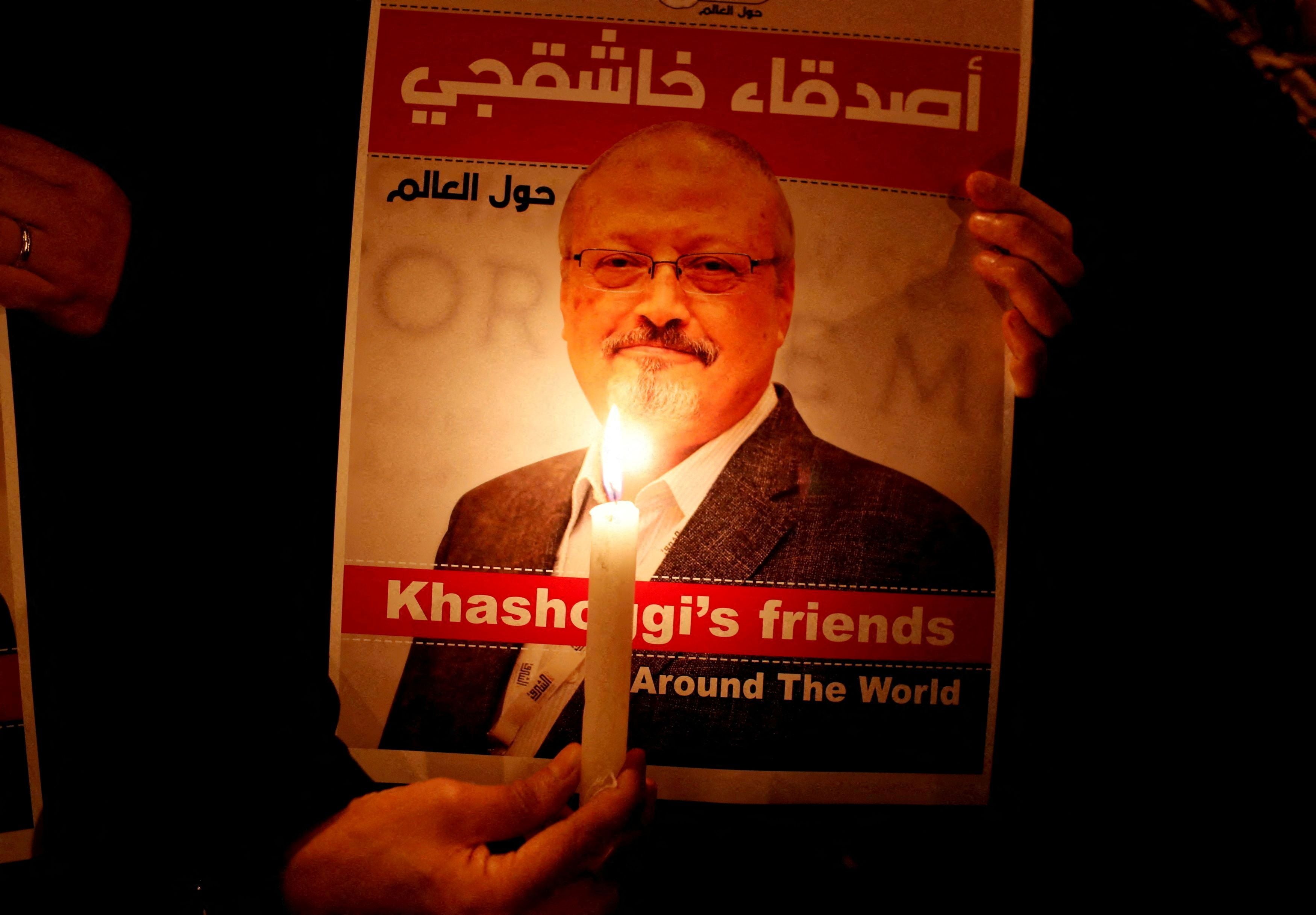 A demonstrator holds a picture of Jamal Khashoggi outside the Saudi Arabian consulate in Istanbul in 2018