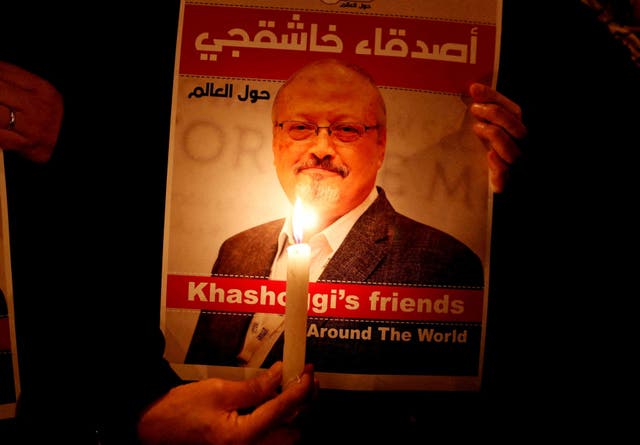 <p>A demonstrator holds a picture of Jamal Khashoggi outside the Saudi Arabian consulate in Istanbul in 2018</p>