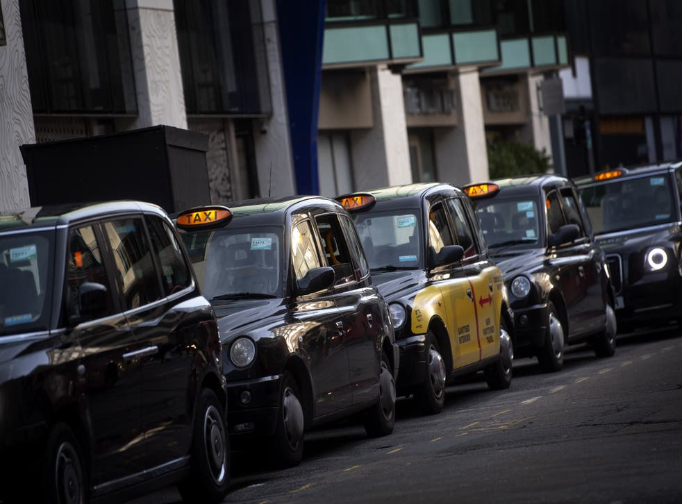 A queue of black cabs outside Victoria Station, London. Black cab fares are said to be staying the same in the dispute (PA)