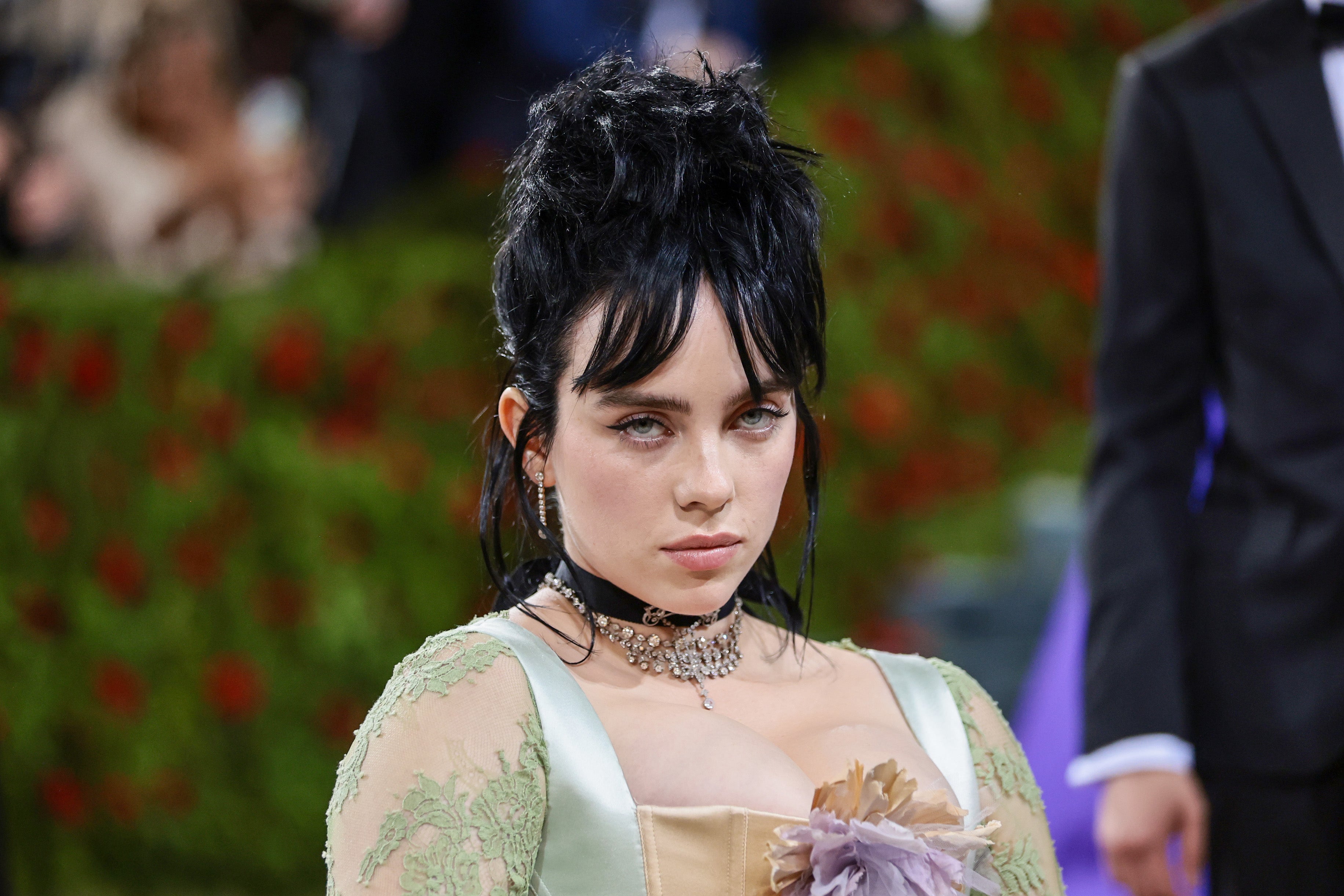 Billie Eilish reveals she slept in same bed as brother and parents