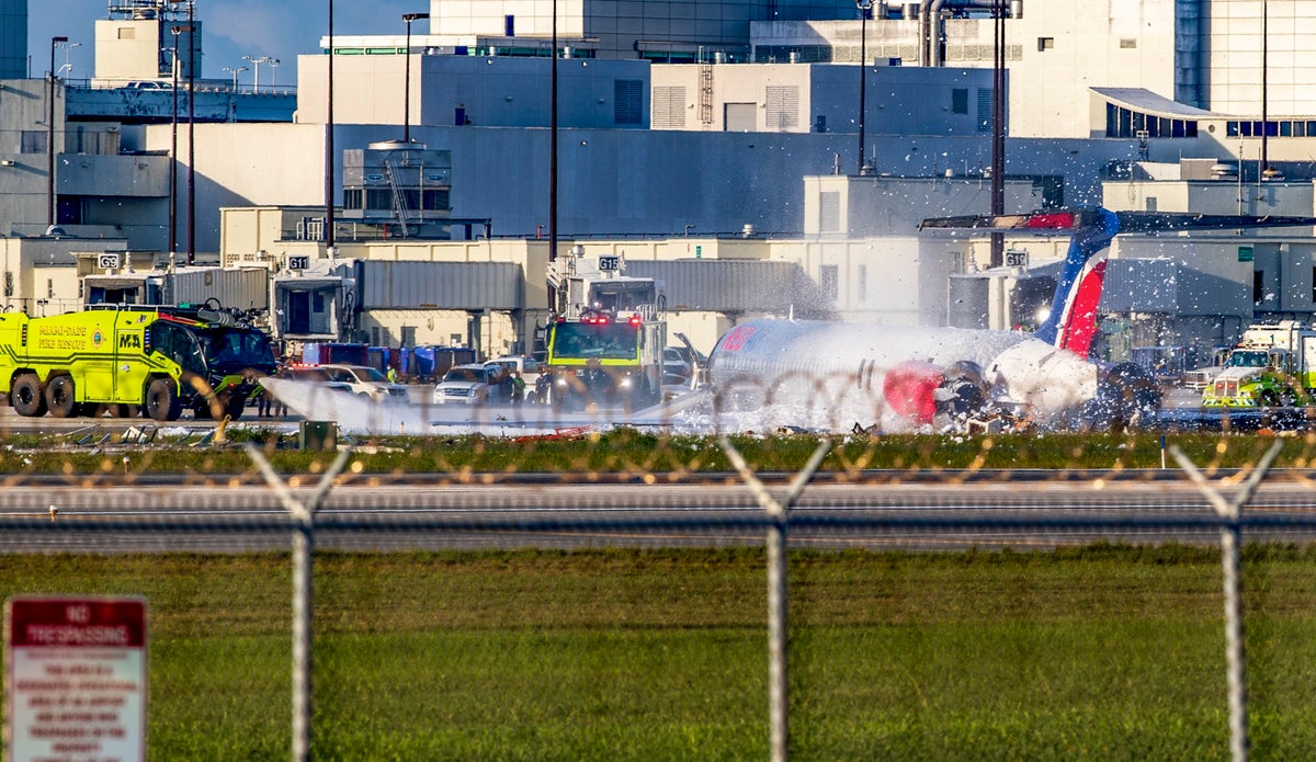 Miami plane crash – live: Aircraft of 126 crash lands at Florida airport as video captures passengers fleeing