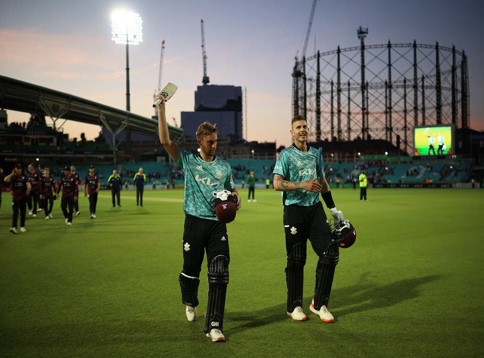 <p>Surrey’s Conor McKerr and Will Jacks leave the field</p>