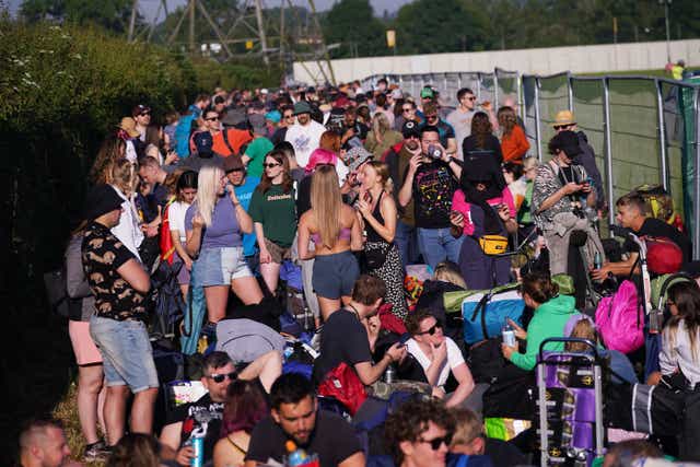 <p>Festival-goers queuing for entry on the first day of Glastonbury at Worthy Farm in Somerset (Yui Mok/PA)</p>