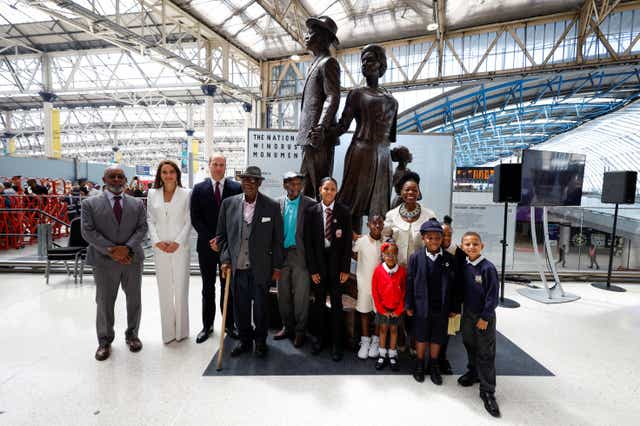 The Duke and Duchess of Cambridge, accompanied by Baroness Floella Benjamin, Windrush passengers Alford Gardner and John Richards and children at the unveiling of the National Windrush Monument at Waterloo Station, to mark Windrush Day (John Sibley/PA)