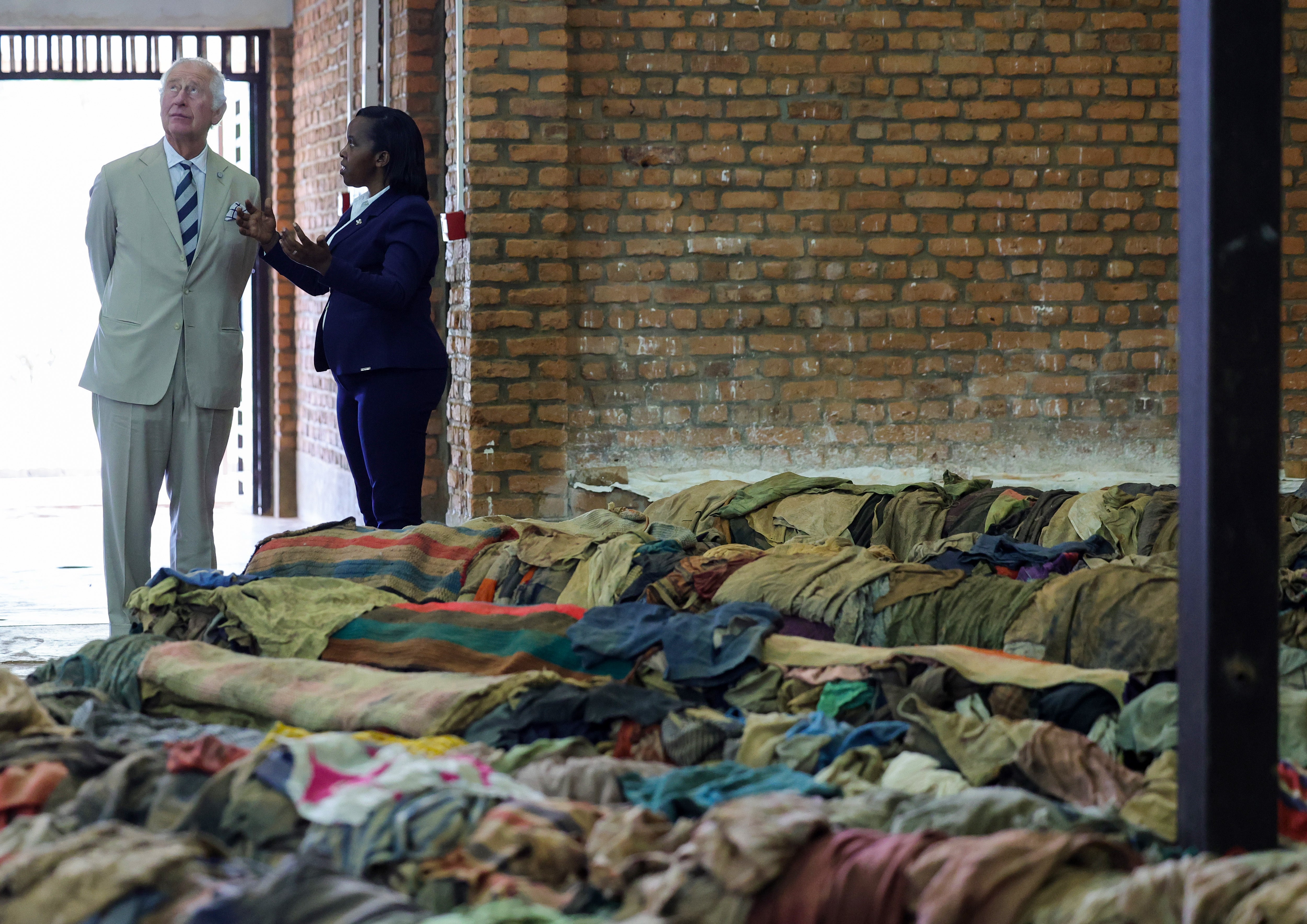Charles is shown victims’ clothes during his visit to the Nyamata Church Genocide Memorial (Chris Jackson/PA)