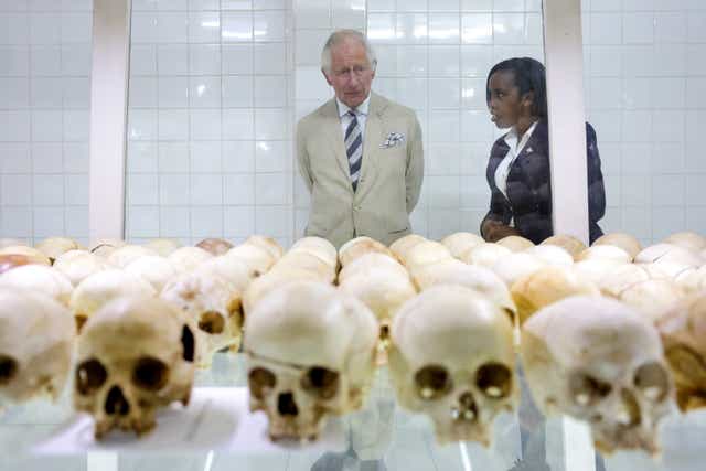 Manager Rachel Murekatete shows the Prince of Wales skulls of victims during his visit to the Nyamata Church Genocide Memorial, as part of his visit to Rwanda (Chris Jackson/PA)