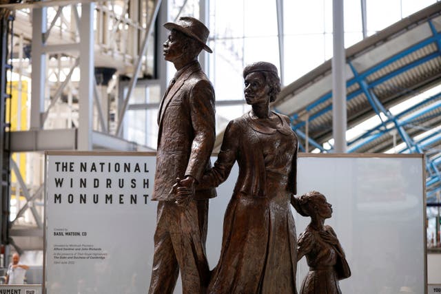 <p>A view of the National Windrush Monument unveiled at Waterloo Station in London last summer </p>