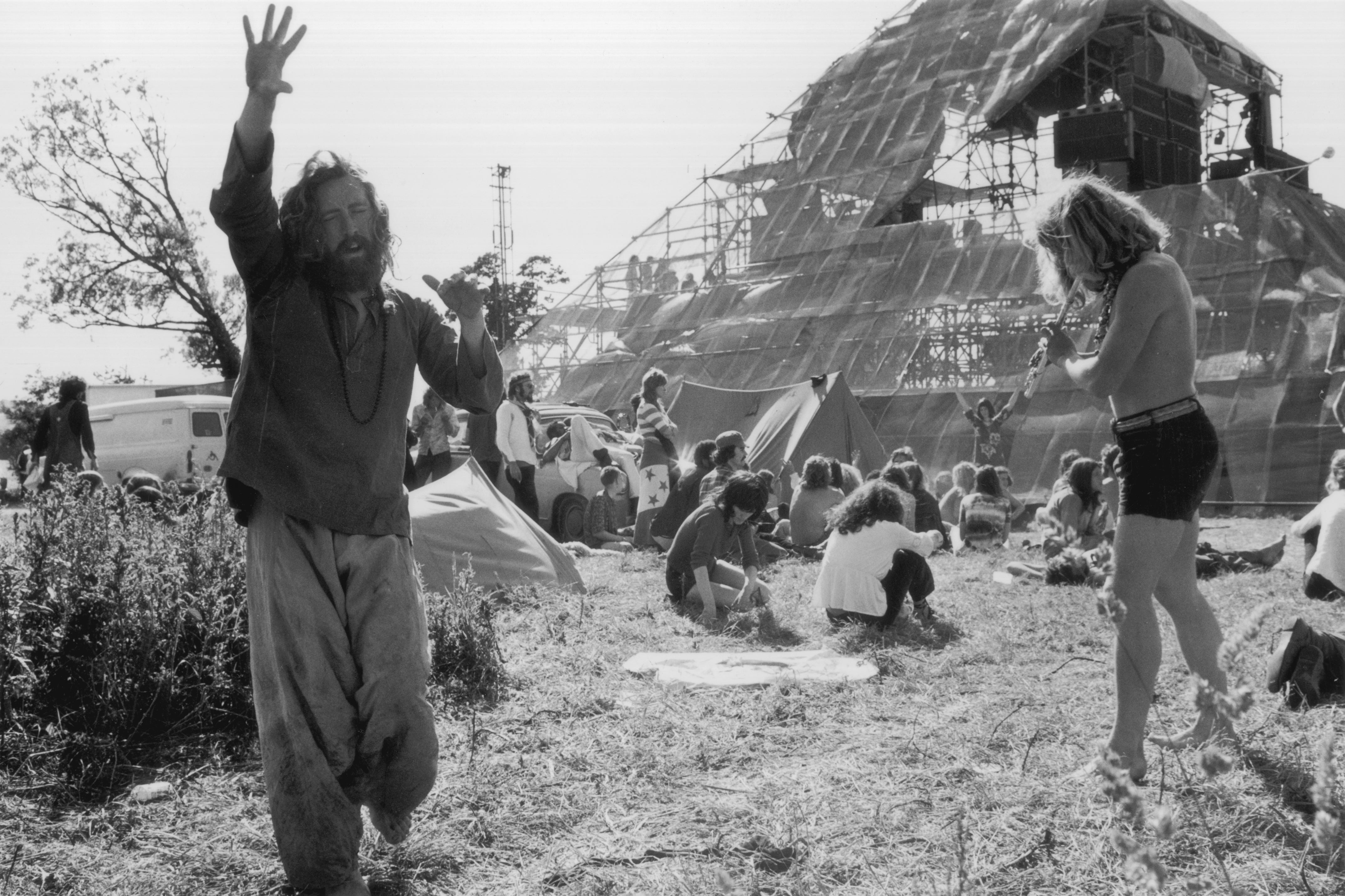 June 1971: Hippies at the second Glastonbury Festival celebrate the summer solstice with music and dancing
