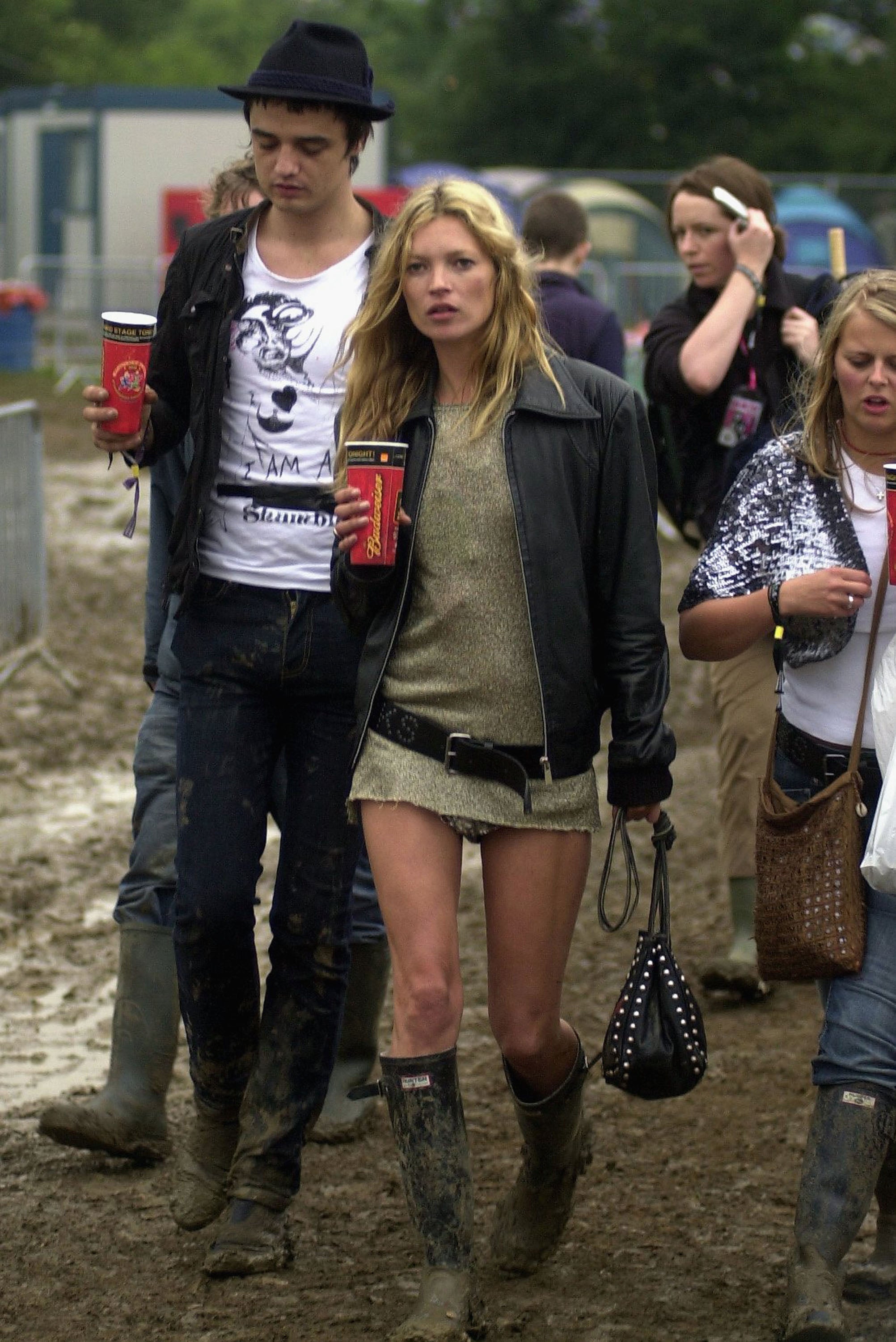 Kate Moss and Pete Doherty walk backstage in 2005