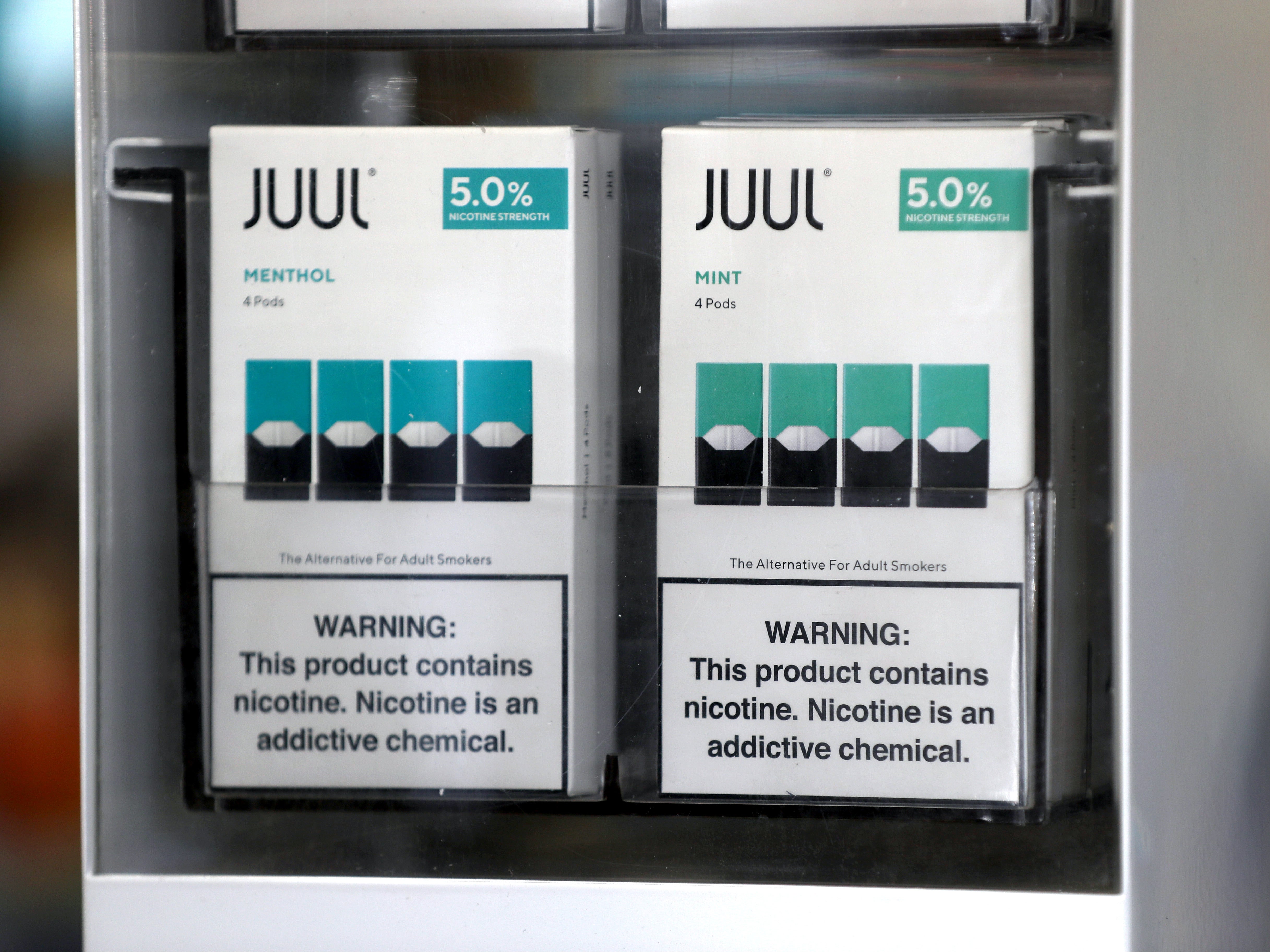 Packages of Juul mint flavored e-cigarettes are displayed at San Rafael Smokeshop on November 07, 2019 in San Rafael, California
