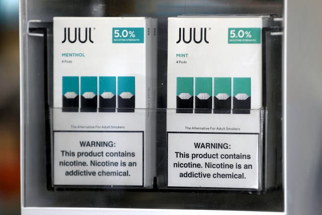 <p>Packages of Juul mint flavored e-cigarettes are displayed at San Rafael Smokeshop on November 07, 2019 in San Rafael, California</p>