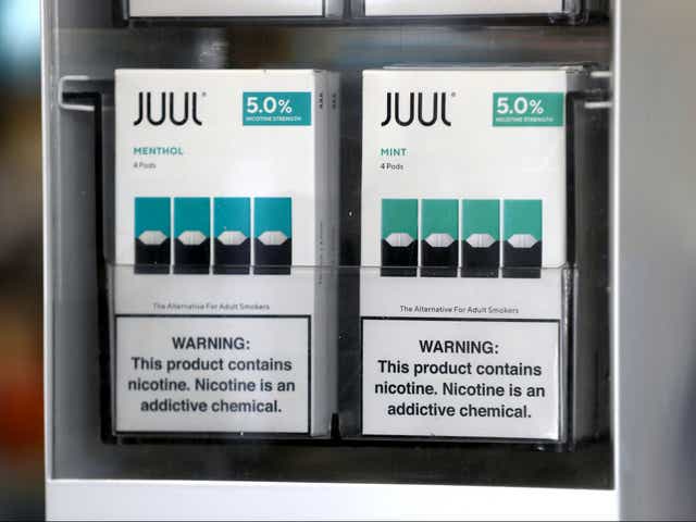 <p>Packages of Juul mint flavored e-cigarettes are displayed at San Rafael Smokeshop on November 07, 2019 in San Rafael, California</p>