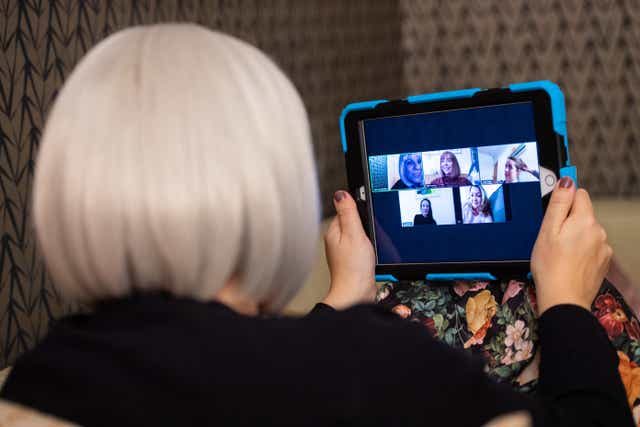 A group of women use the Zoom video conferencing application to have a group chat from their separate homes (PA)