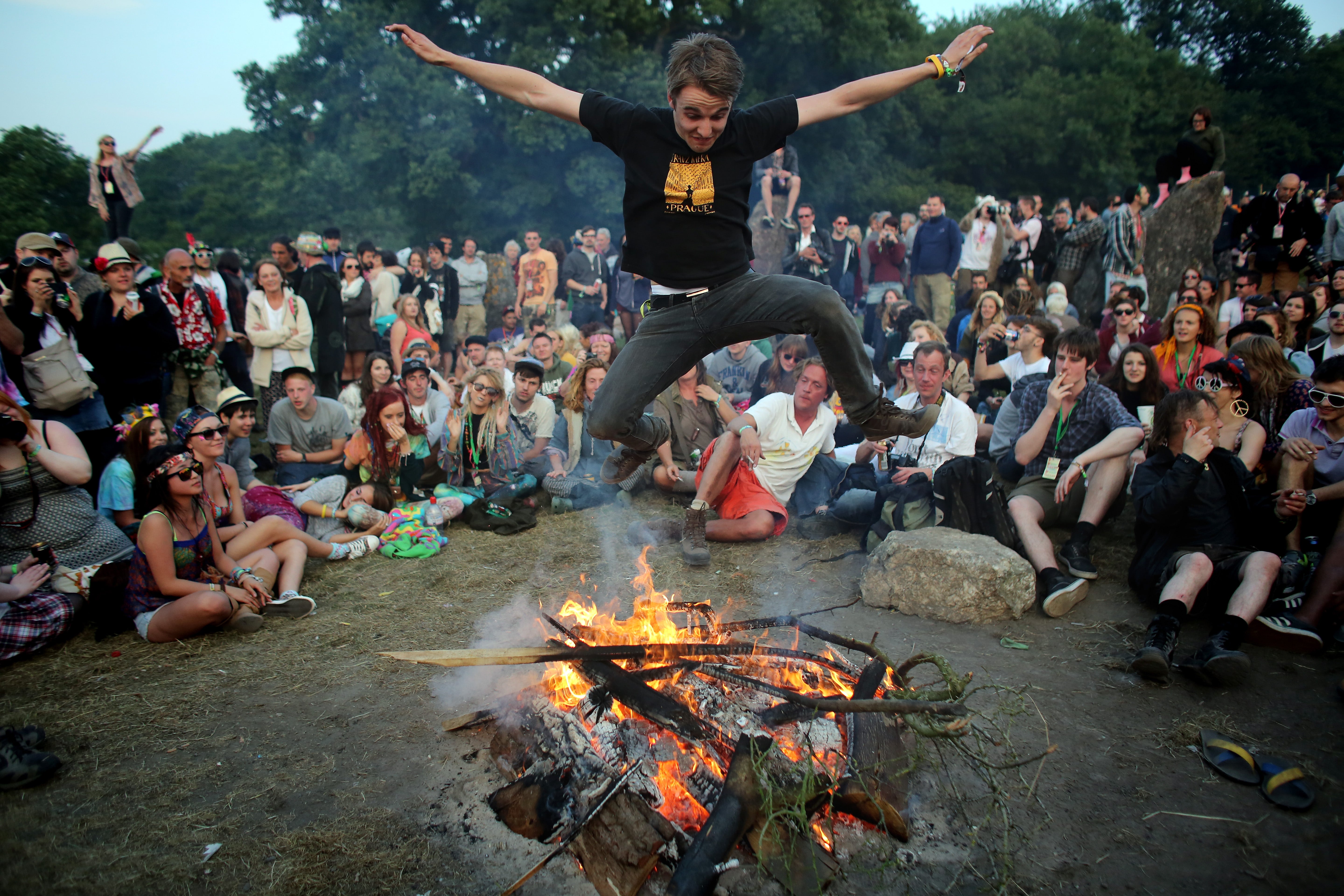 A man jumps over a fire in 2013