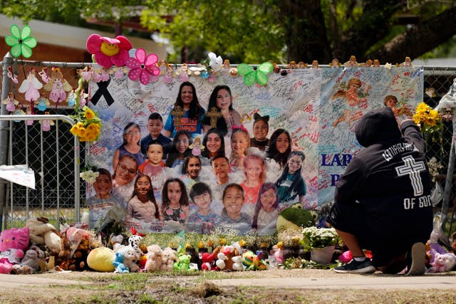<p>A memorial outside Robb Elementary School in honour of the 21 victims killed in the mass shooting</p>