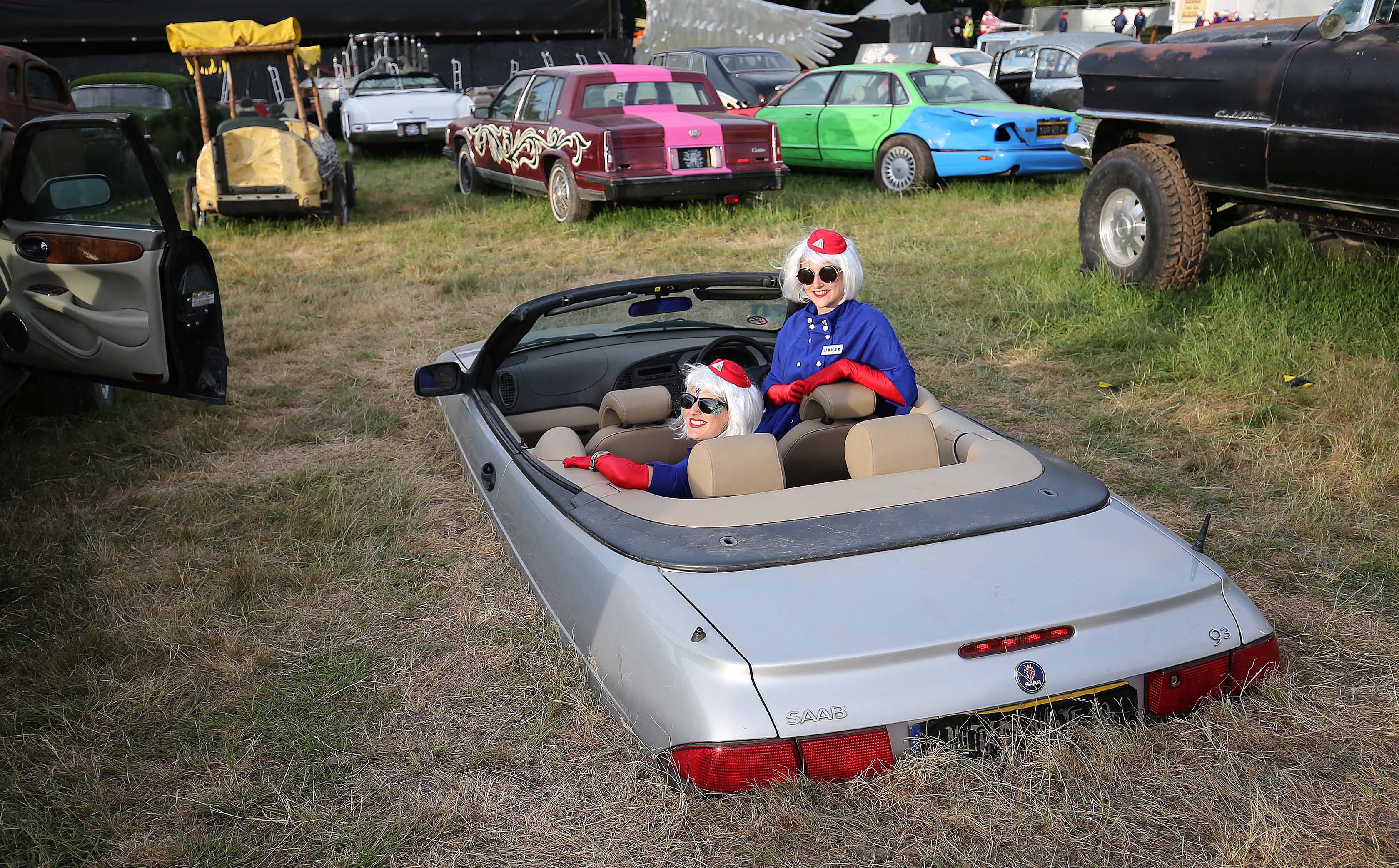 Ushers pose in a convertible at the Cinemageddon event in 2017