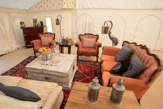 <p>Glamping in the ‘Tenthouse Suite’ at Glastonbury Festival</p>