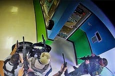 New photo captures heavily armed officers outside Uvalde classroom 46 minutes before shooting gunman