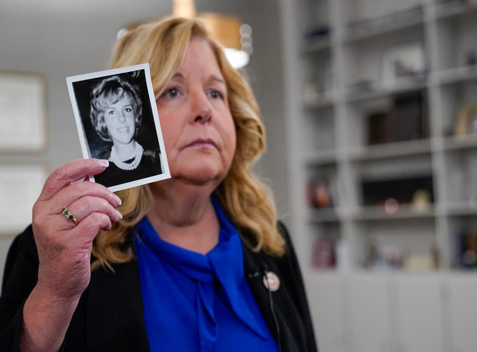 <p>Nassau County district attorney Anne Donnelly shows a photo of Diane Cusick on 22 June</p>