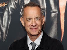 Tom Hanks says it’s an ‘honour’ to crash weddings, after being repeatedly photographed with newly-wed couples