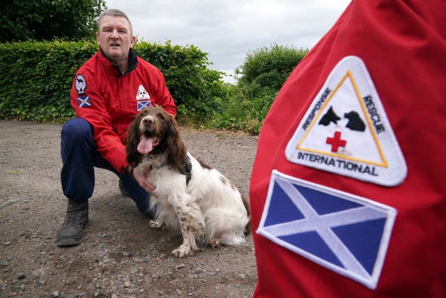 John Miskelly with his dog Bracken at his home in Falkland, Fife (Andrew Milligan/PA)