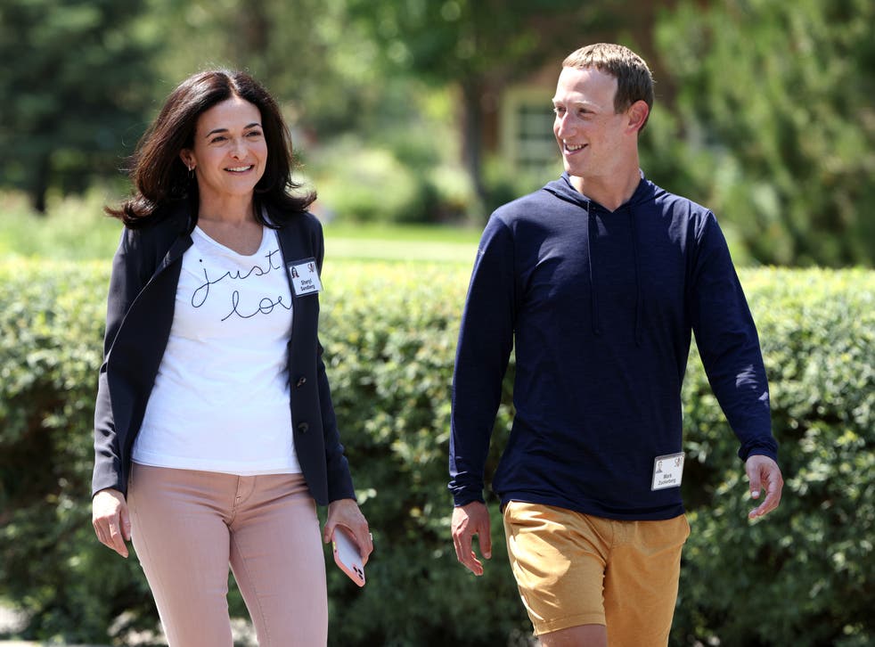 <p>Facebook chief executive Mark Zuckerberg walks with former Facebook chief operating officer Sheryl Sandberg after a session at the Allen & Company Sun Valley Conference on 8 July 2021 in Sun Valley, Idaho</p>