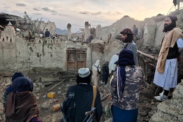<p>In this photo released by a state-run news agency Bakhtar, Afghans look at destruction caused by an earthquake in the province of Paktika, eastern Afghanistan, Wednesday, June 22, 2022 </p>