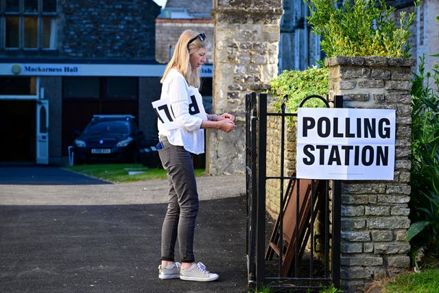 <p>Signs are put up at a polling station in the Tiverton and Honiton by-election</p>