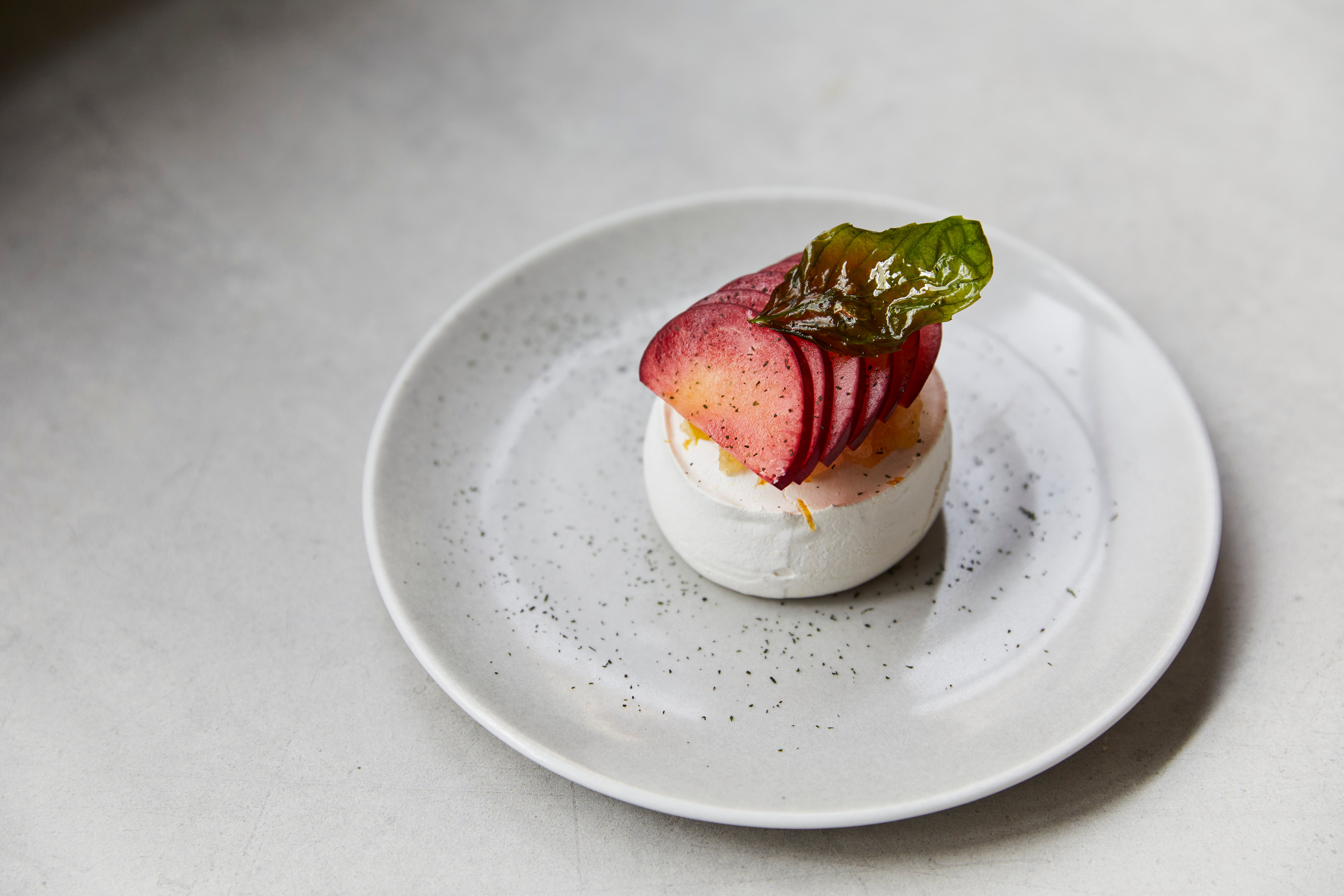 A single fried basil leaf transforms this light dessert