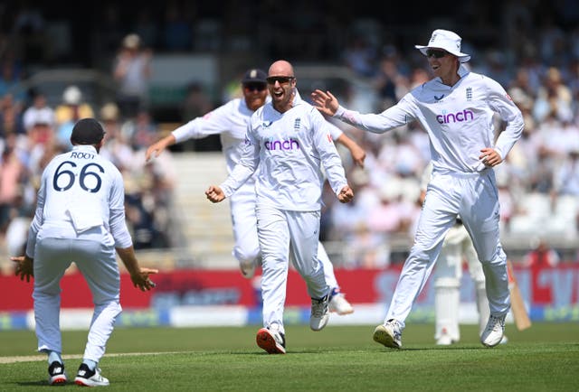 <p>Jack Leach celebrates taking the wicket of Will Young</p>