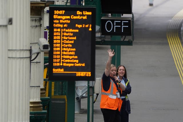 Train staff wave off a train at Waverley Station in Edinburgh, as train services continue to be disrupted following the nationwide strike. Boris Johnson called the strike a “terrible idea” (Andrew Milligan/PA)