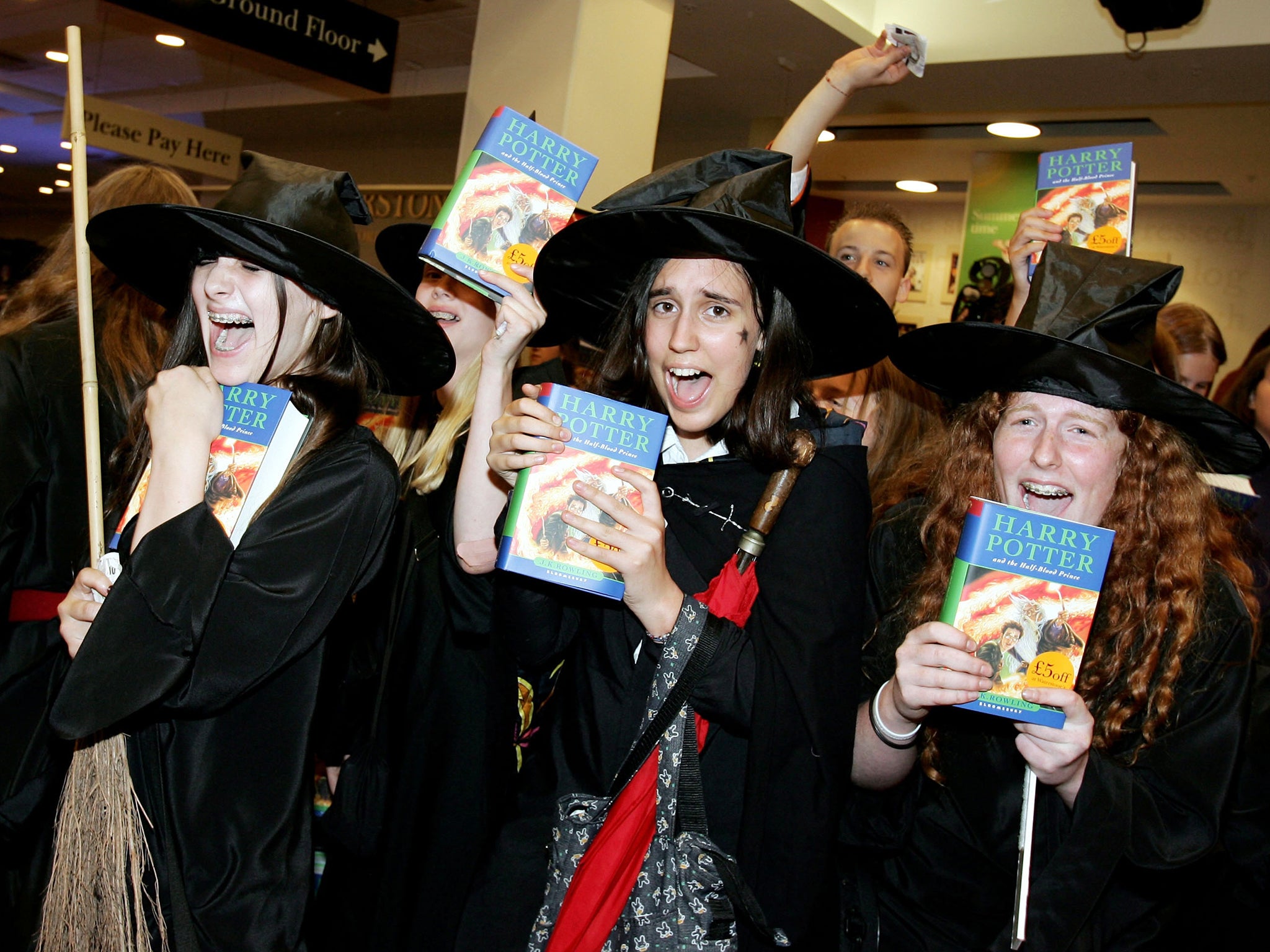<p>Harry Potter fans pick up fresh copies of ‘The Half-Blood Prince’ at a midnight opening in London in 2005</p>
