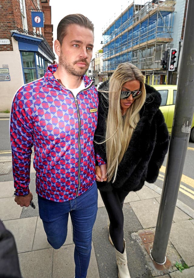 Katie Price alongside fiancee Carl Woods arrives at Lewes Crown Court, West Sussex, where she is appearing on charges of breaching a restraining order. Picture date: Wednesday May 25, 2022 (Steve Parsons/PA)