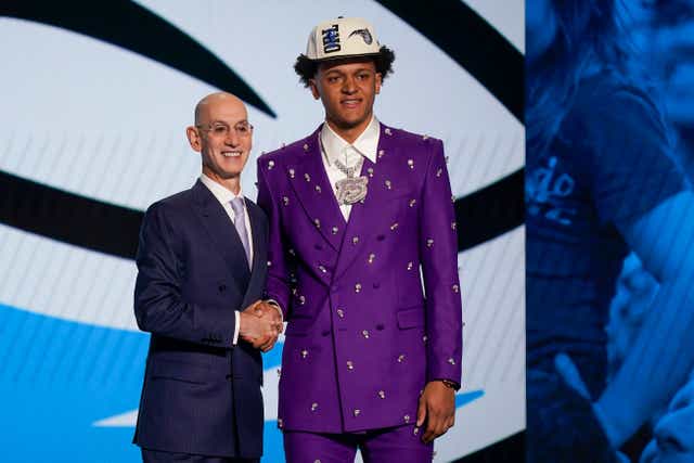 Paolo Banchero, right, with NBA commissioner Adam Silver after being selected as the number one pick overall by the Orlando Magic in the NBA Draft (John Minchillo/AP/PA)
