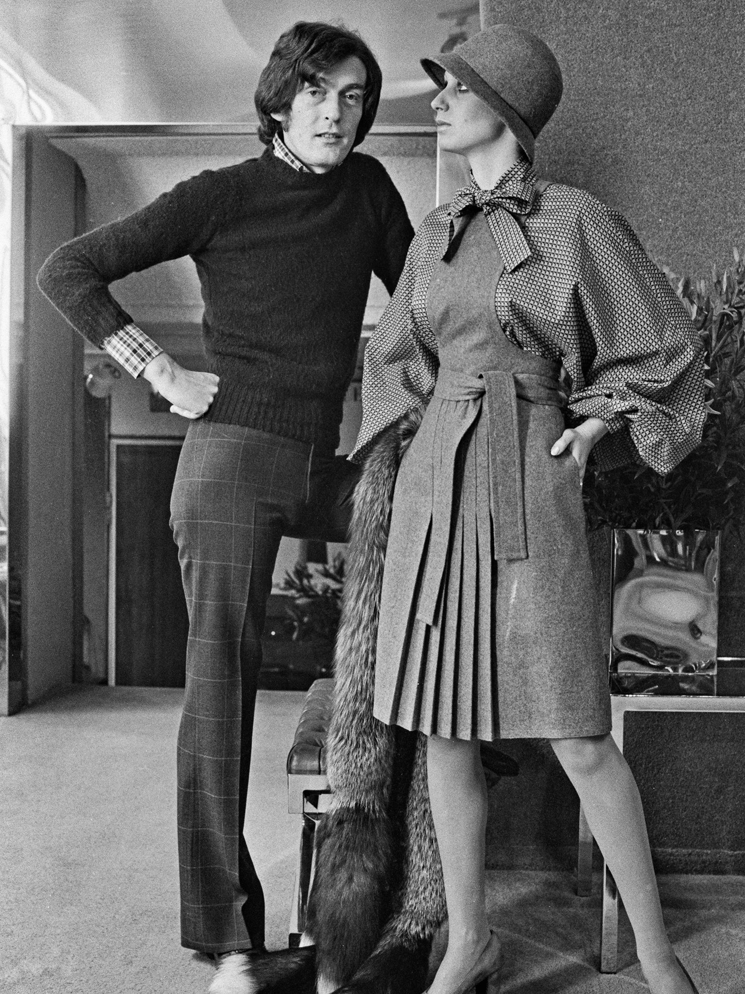 Bates with a model wearing one of his designs in 1973