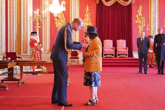Figen Murray from Poynton is made an OBE (Officer of the Order of the British Empire) by the Duke of Cambridge at Buckingham Palace. Picture date: Friday June 24, 2022 (Dominic Lipinski/PA)