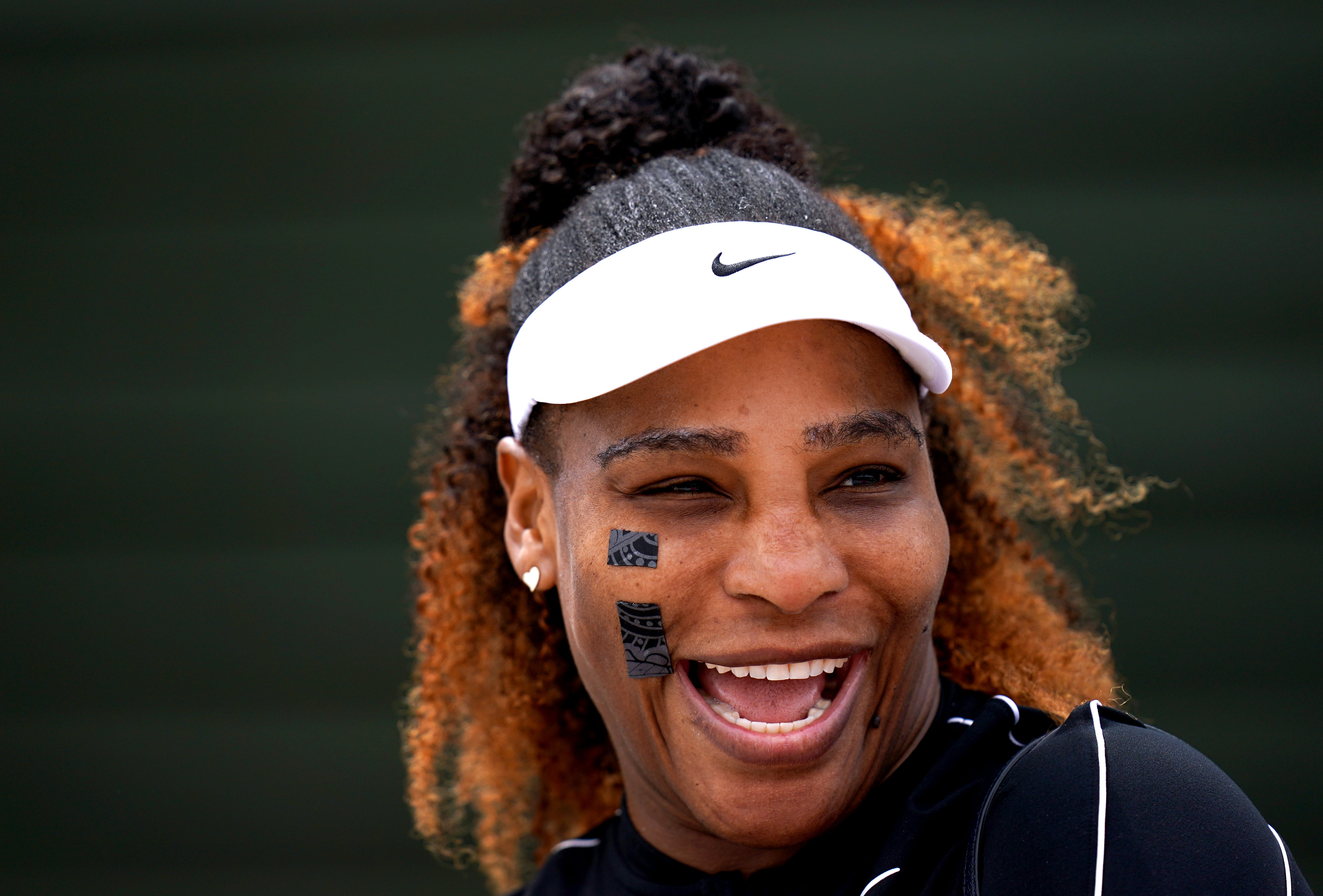 Serena Williams laughs during training at Wimbledon (John Walton/PA)