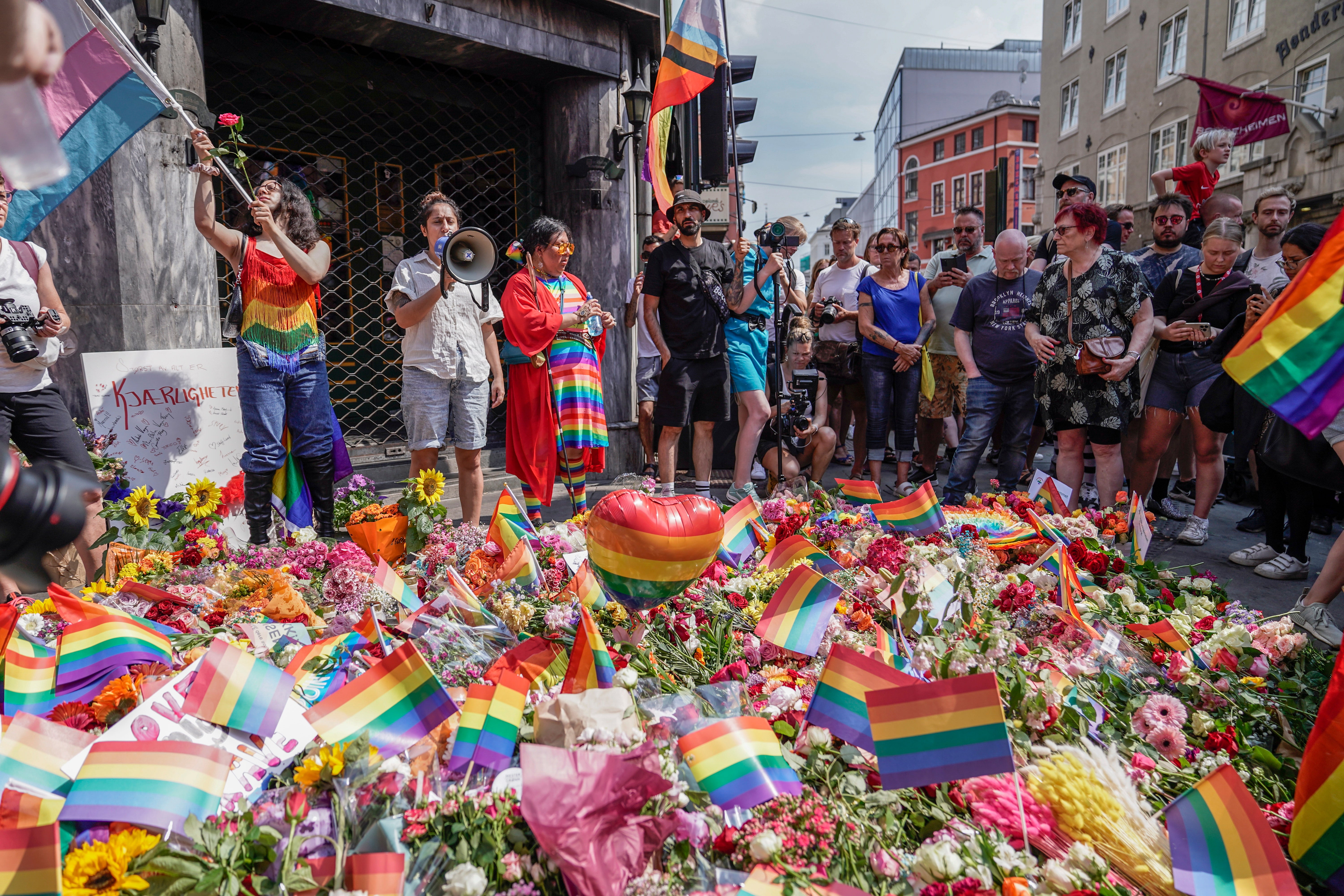 Flowers were left outside venues where a shooter is suspected to have opened fire