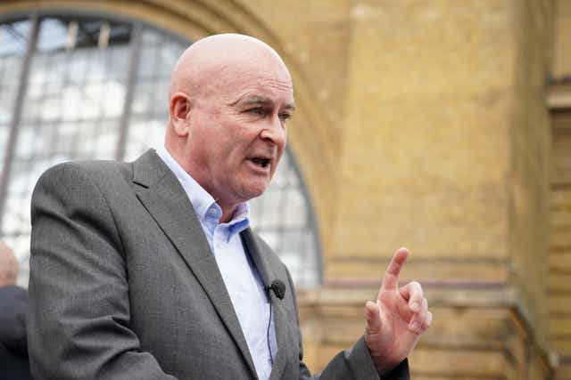 RMT general secretary, Mick Lynch speaking at a rally outside King’s Cross Station on Saturday (Dominic Lipinski/PA)