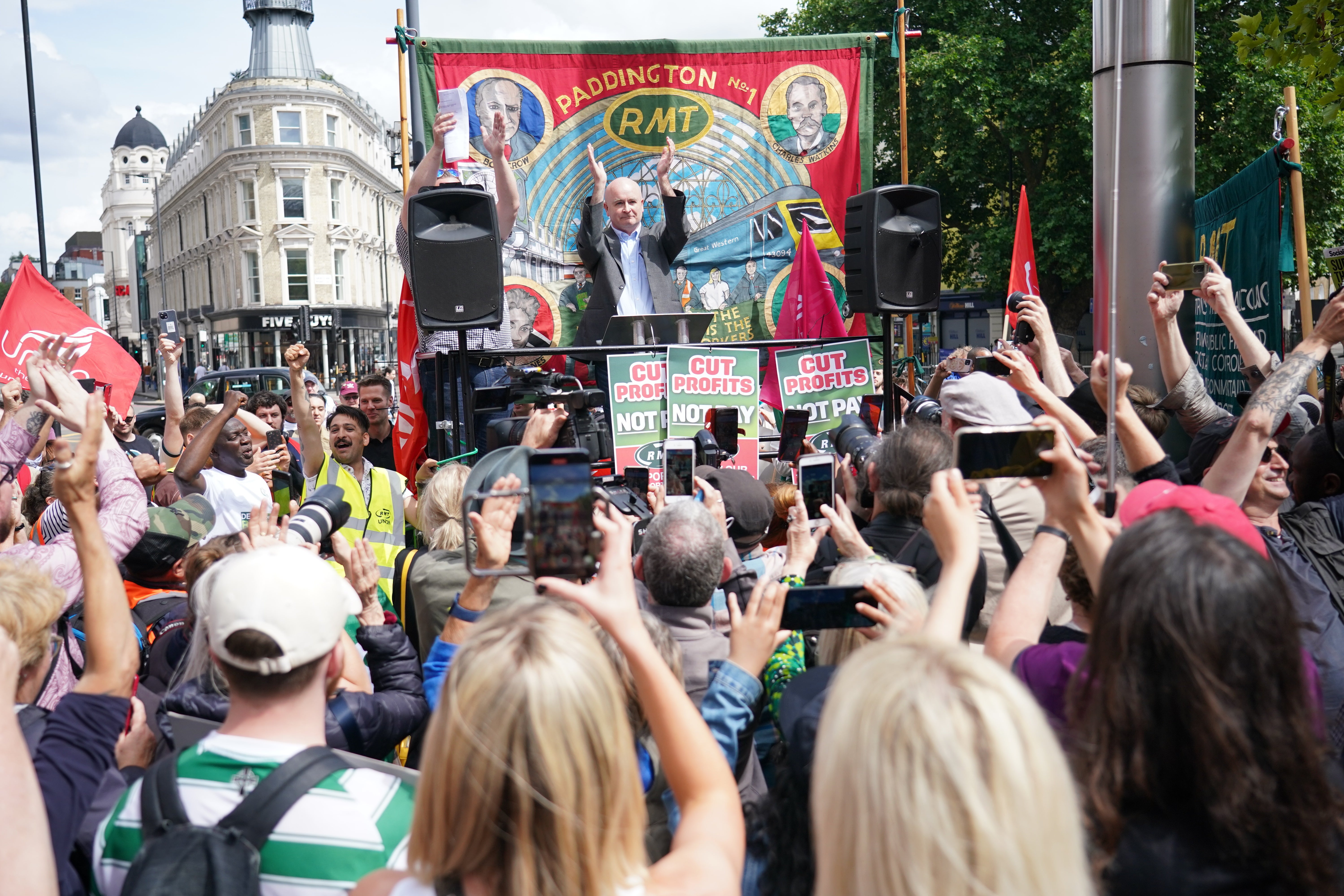 Striking hospital workers turn up at RMT rally in show of support for rail  staff