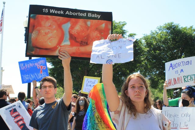 <p>Protesters outside the Supreme Court in Washington DC</p>