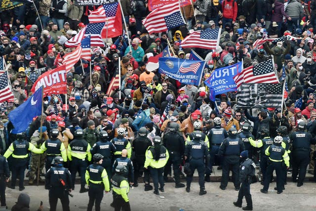<p>Trump supporters clash with police and security forces as they storm the US Capitol in Washington, DC</p>