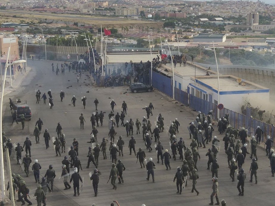 <p>Hundreds of migrants crossing the Spanish and Morocco Melilla border near Nador, Morocco</p>