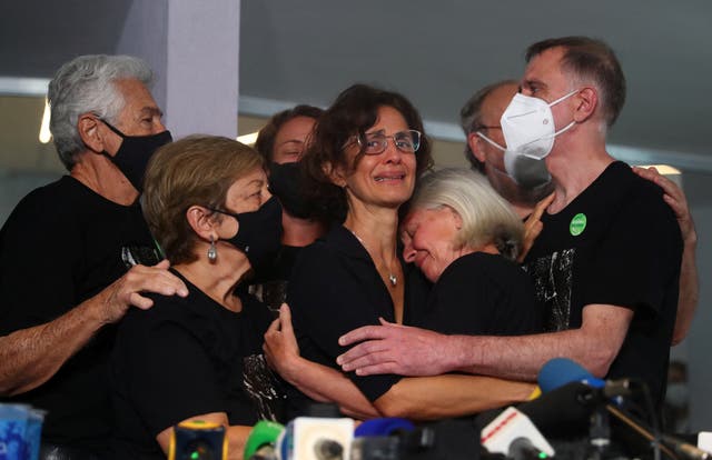 <p>Alessandra Sampaio, wife of Dom Phillips, is embraced by family during the British journalist’s funeral</p>