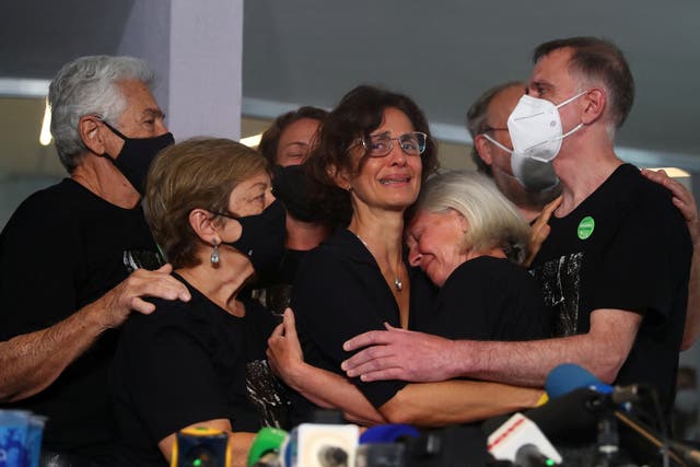 <p>Alessandra Sampaio, wife of Dom Phillips, is embraced by family during the British journalist’s funeral</p>
