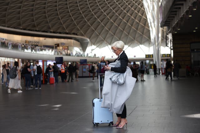 <p>A passenger at Kings Cross station on June 25, 2022 in London, United Kingdom</p>