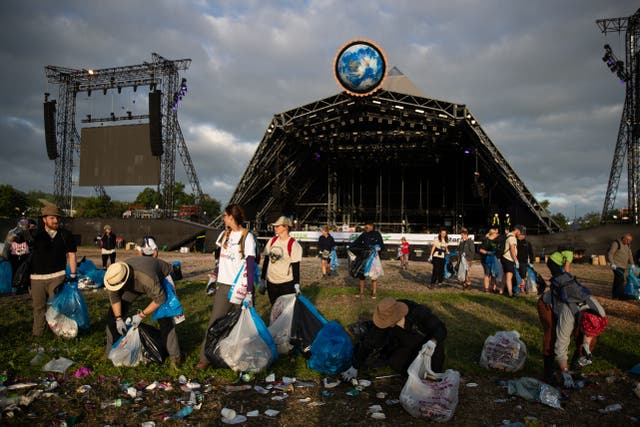 Clean up begins in front of the pyramid stage at the Glastonbury Festival at Worthy Farm in Somerset (Aaron Chown/PA)