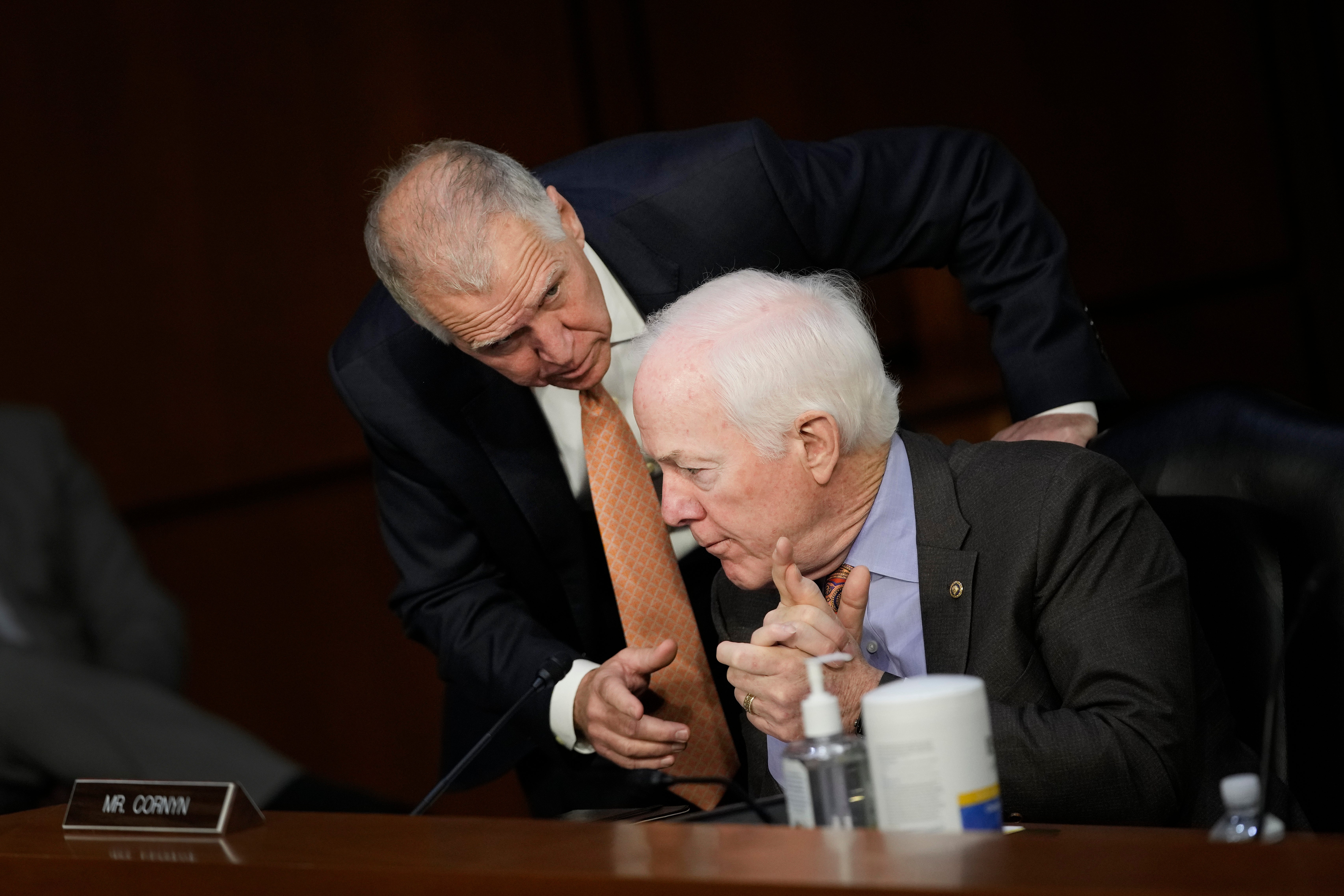 Mr Tillis (left) talks to Sen. John Cornyn (R-TX) during U.S. Supreme Court nominee Judge Ketanji Brown Jackson’s nomination hearing. The two were the main Republican negotiators on gun legislation.